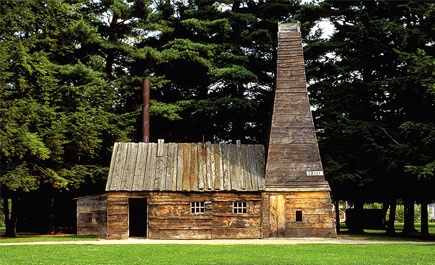 Replica wooden derrick and engine house at the Drake Well Museum. 