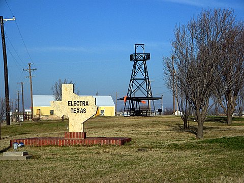 Welcome to Electra, Texas, sign in the shape of Texas with derrick, pump jack and picnic table.