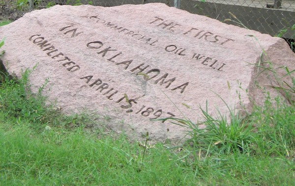 Pink granite marker of April 15, 1897, first commercial Oklahoma oil well.