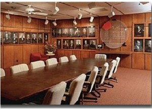 View of board room with wall of photos.
